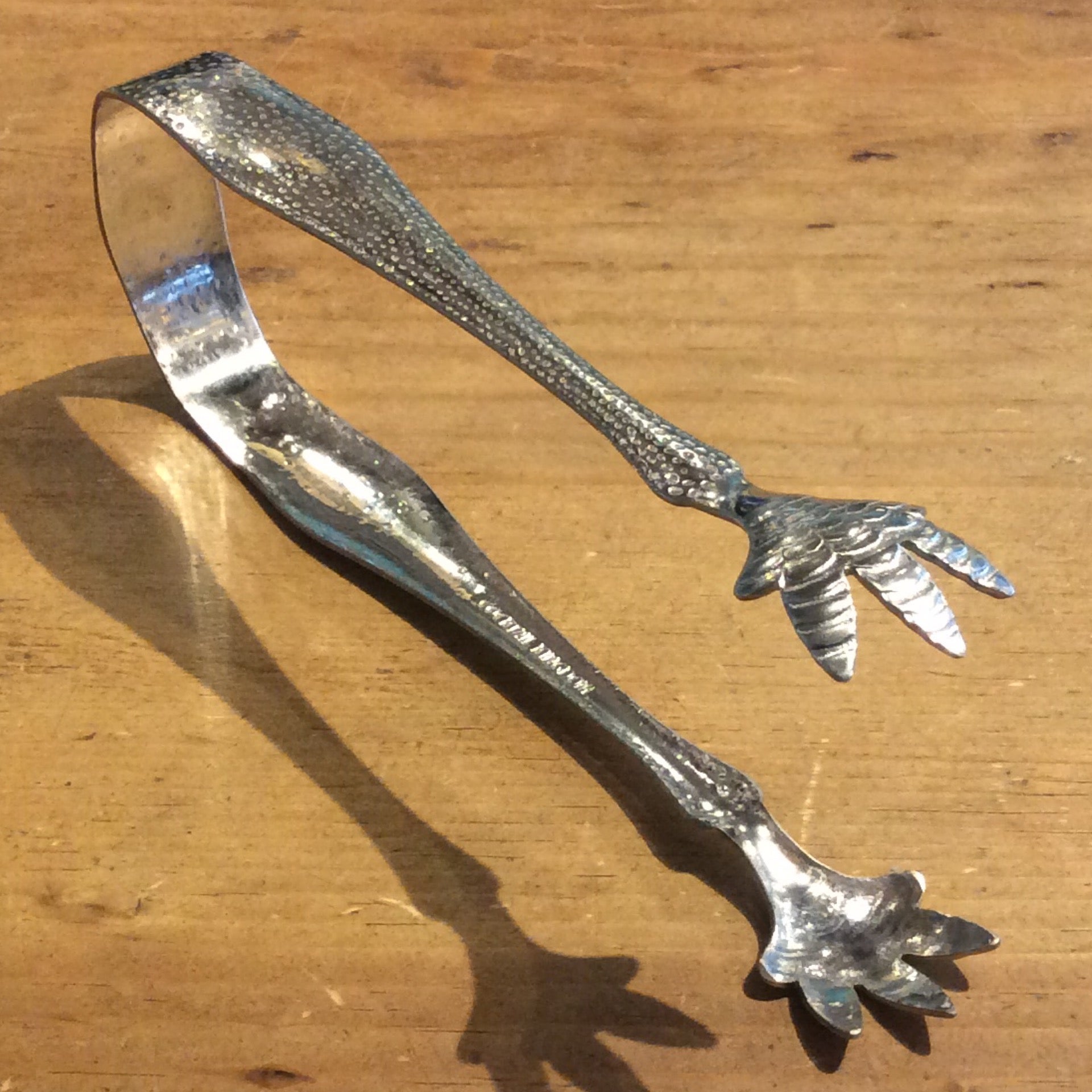 Tongs a talon top